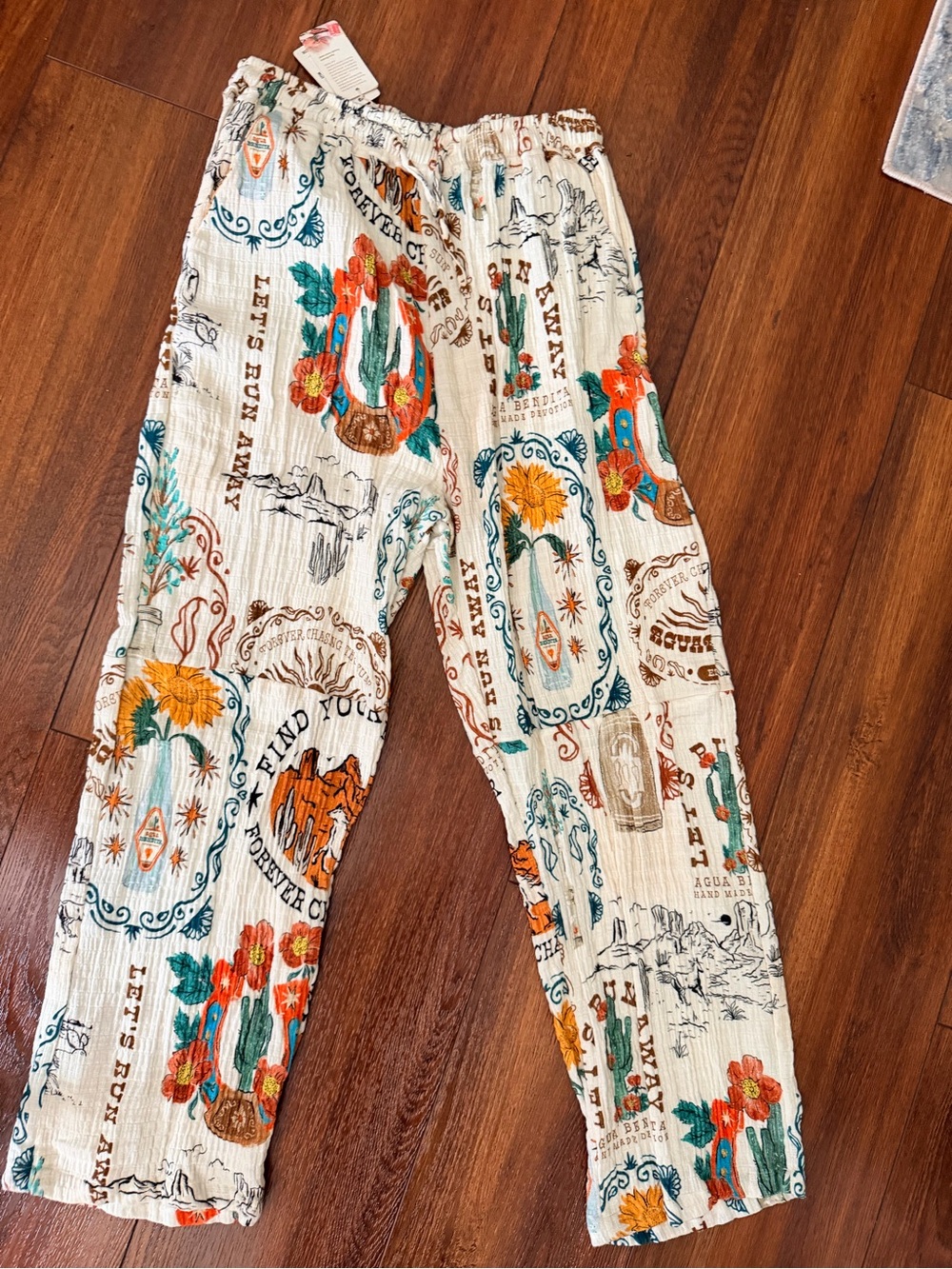 Agua Bendita White Pants with Orange, Teal & Brown Western Floral Print
